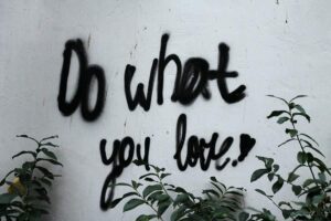 Do what you love spray painted on wall. Start your side hustle!